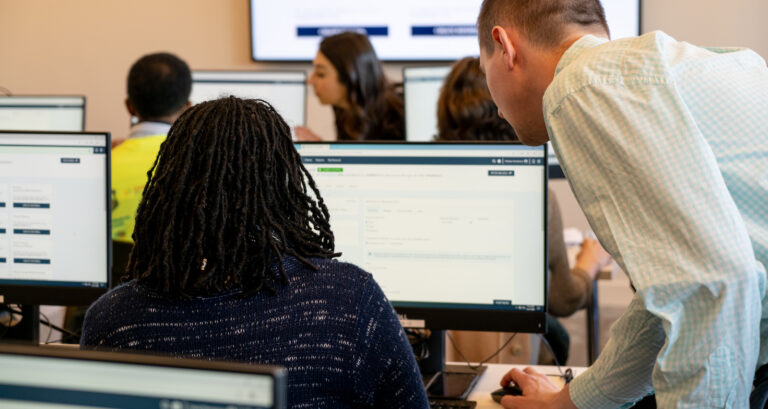 people looking at computer