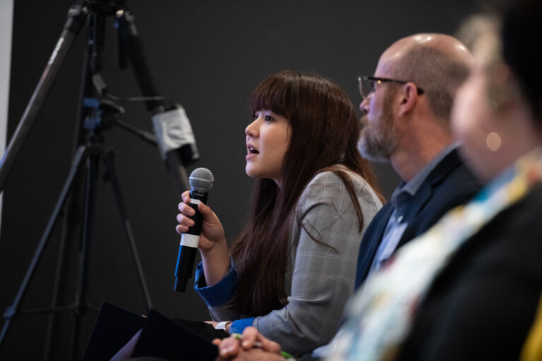 woman in audience asking question