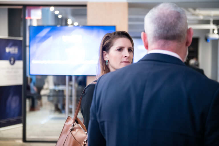 women and man talking at meeting