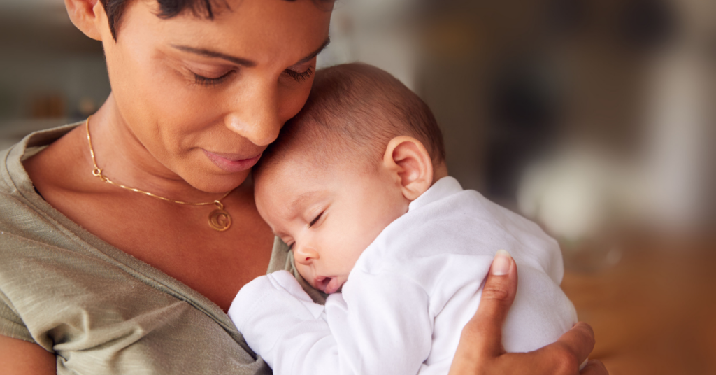 Mother holds newborn child