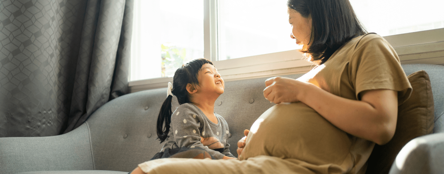 pregnant womain and child laughing