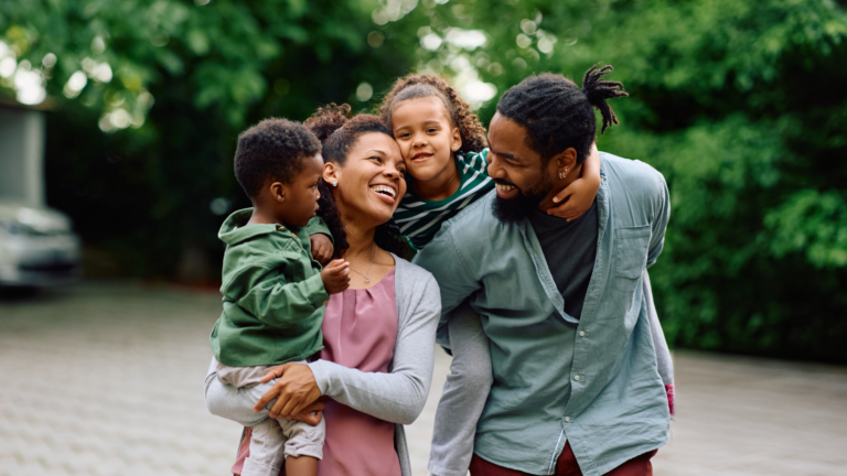 family laughing outside